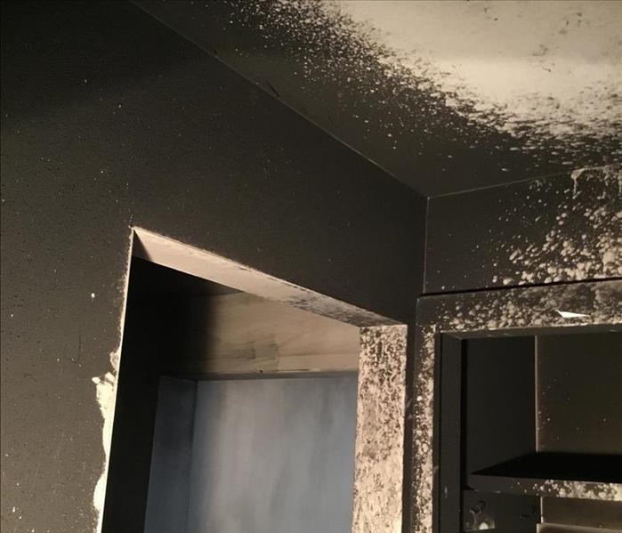 walls of apartment covered in black soot