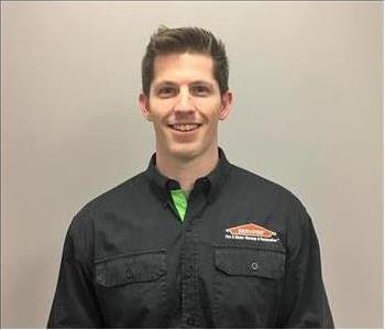 man with short brown hair and servpro shirt on