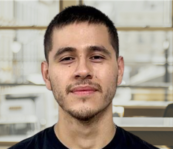 Young man with dark hair and a servpro shirt