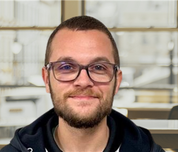 young man with glasses and brown hair