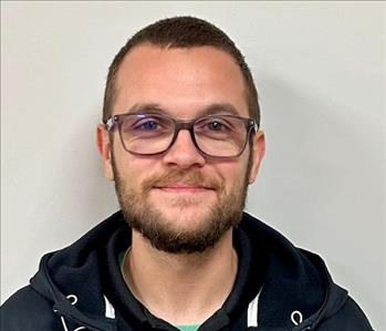 young man with glasses and brown hair