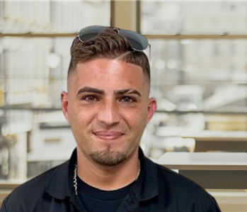 Young man with dark hair and a servpro shirt