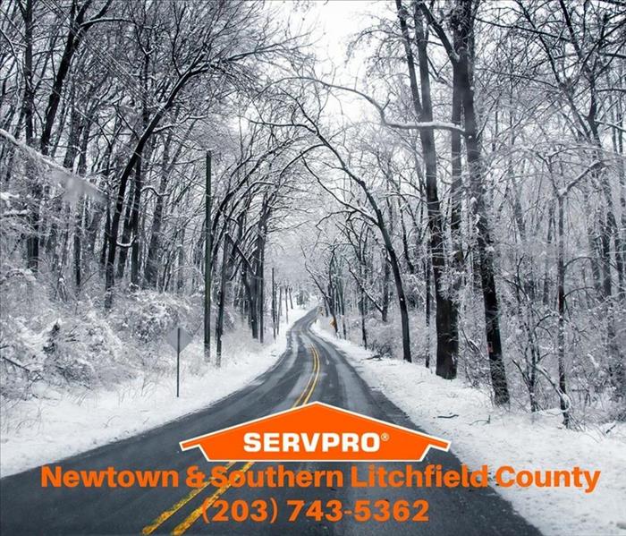 snowy road with the servpro logo