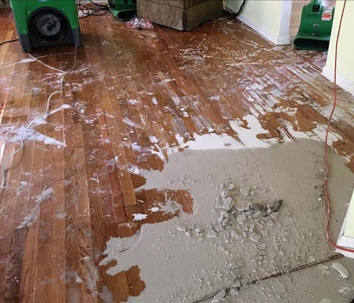 Floor of a home covered with muddy water