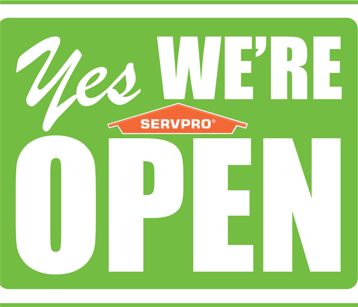 sign that says we're open with SERVPRO logo